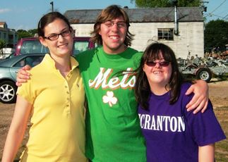 3 athletes pose at practice